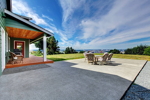 Decorative concrete curbing bordering a landscaped garden bed.